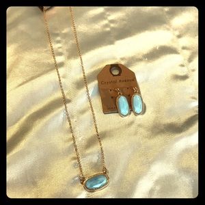 Women’s blue stone and gold necklace and earrings